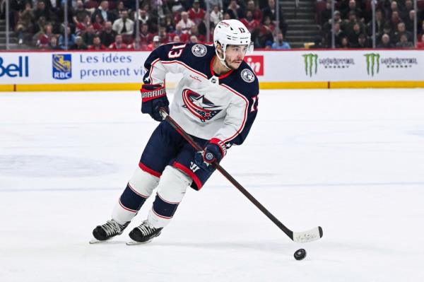 Blue Jackets left wing Johnny Gaudreau (13) plays the puck against the Montreal Canadiens